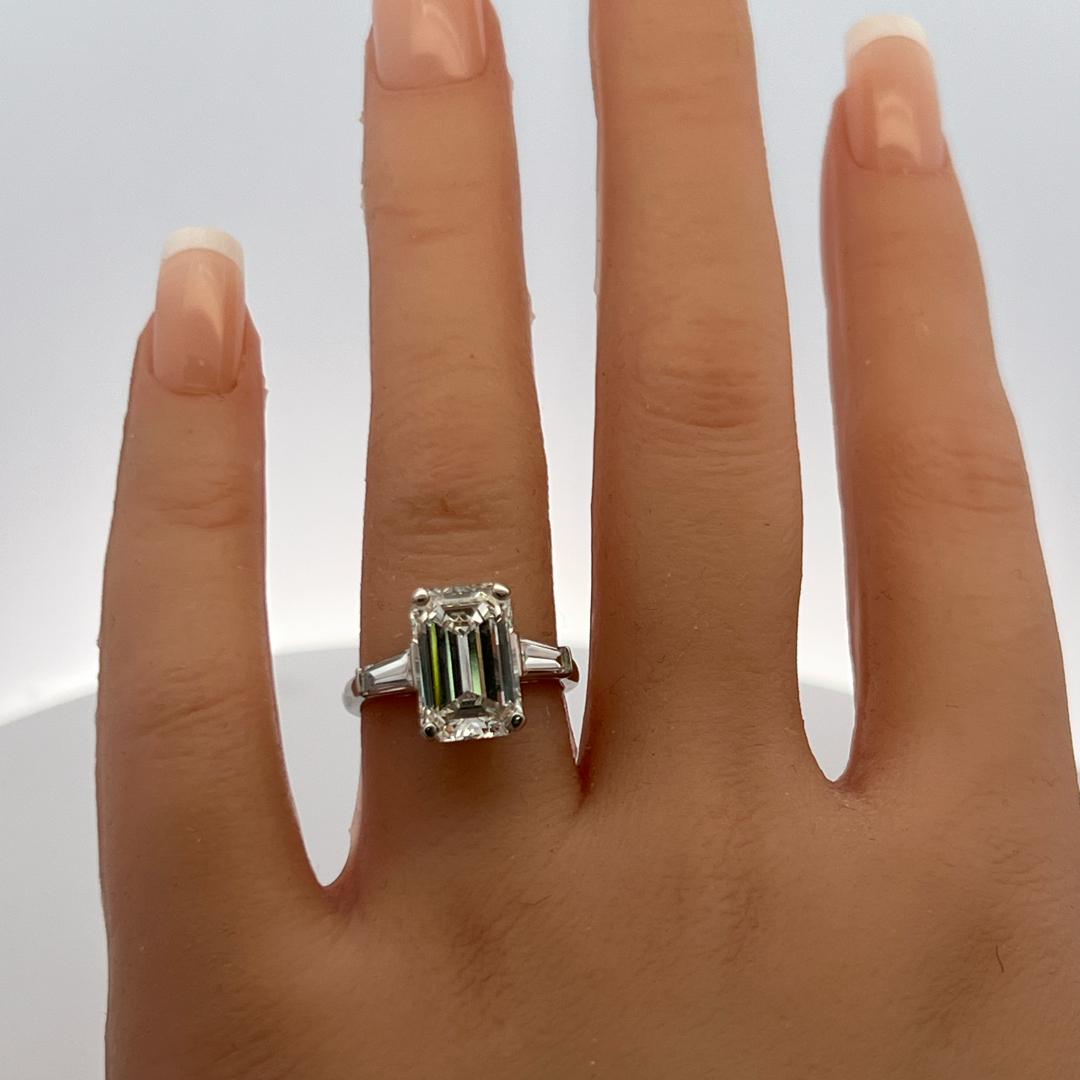 Vintage Platinum Engagement Ring with 4.89 Carat GIA Emerald cut Diamonds H VS1