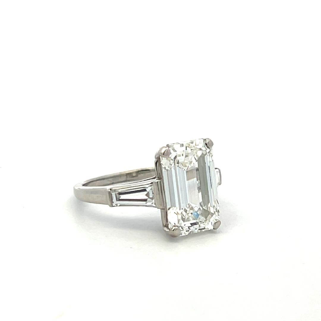 Vintage Platinum Engagement Ring with 4.89 Carat GIA Emerald cut Diamonds H VS1