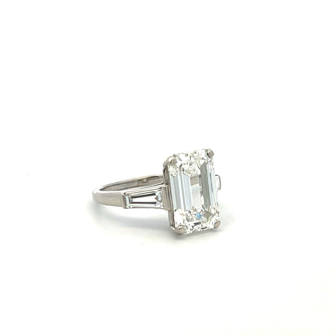 Vintage Platinum Engagement Ring with 4.89 Carat GIA Emerald cut Diamonds H VS1