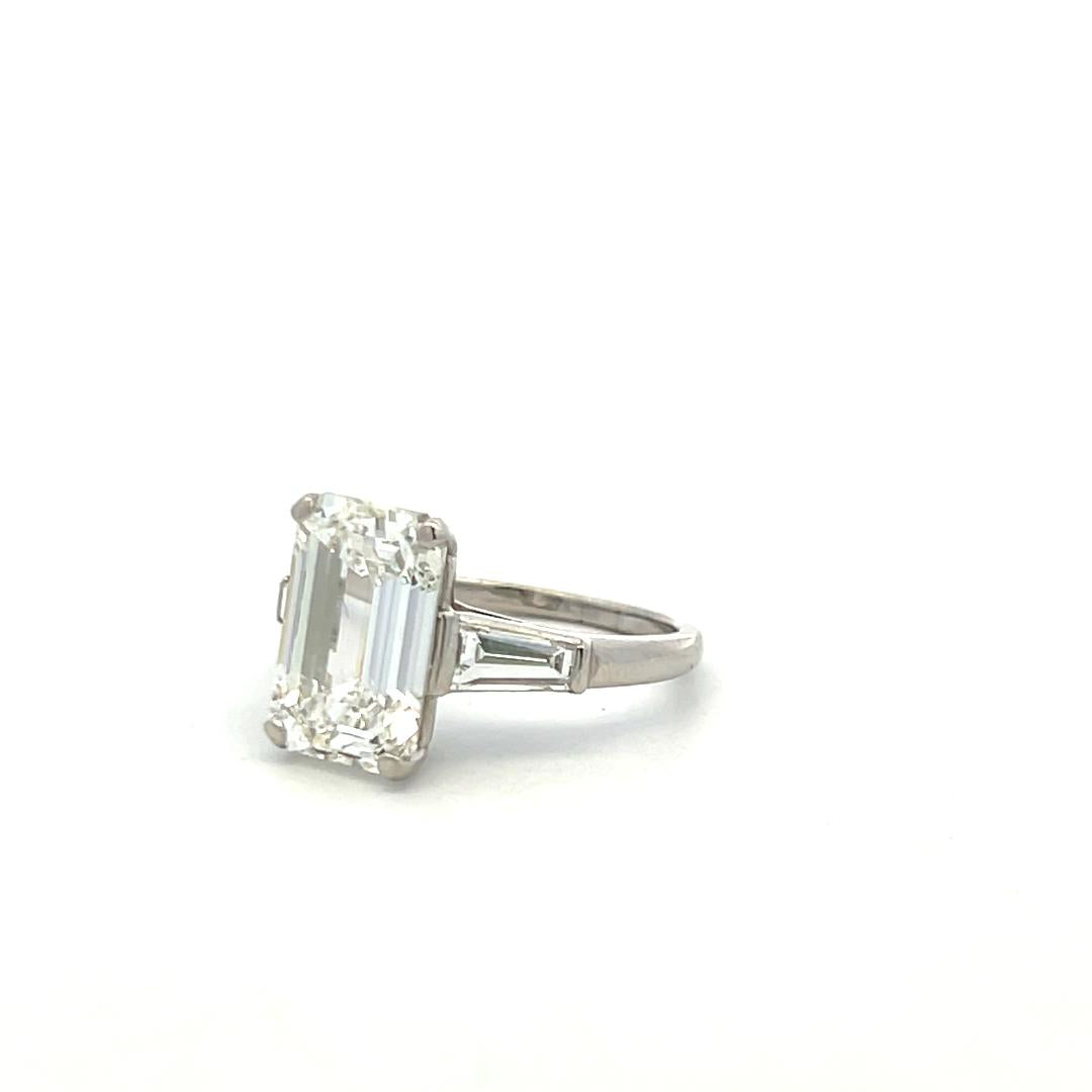 Vintage Platinum Engagement Ring with 4.89 Carat GIA Emerald cut Diamonds H VS1