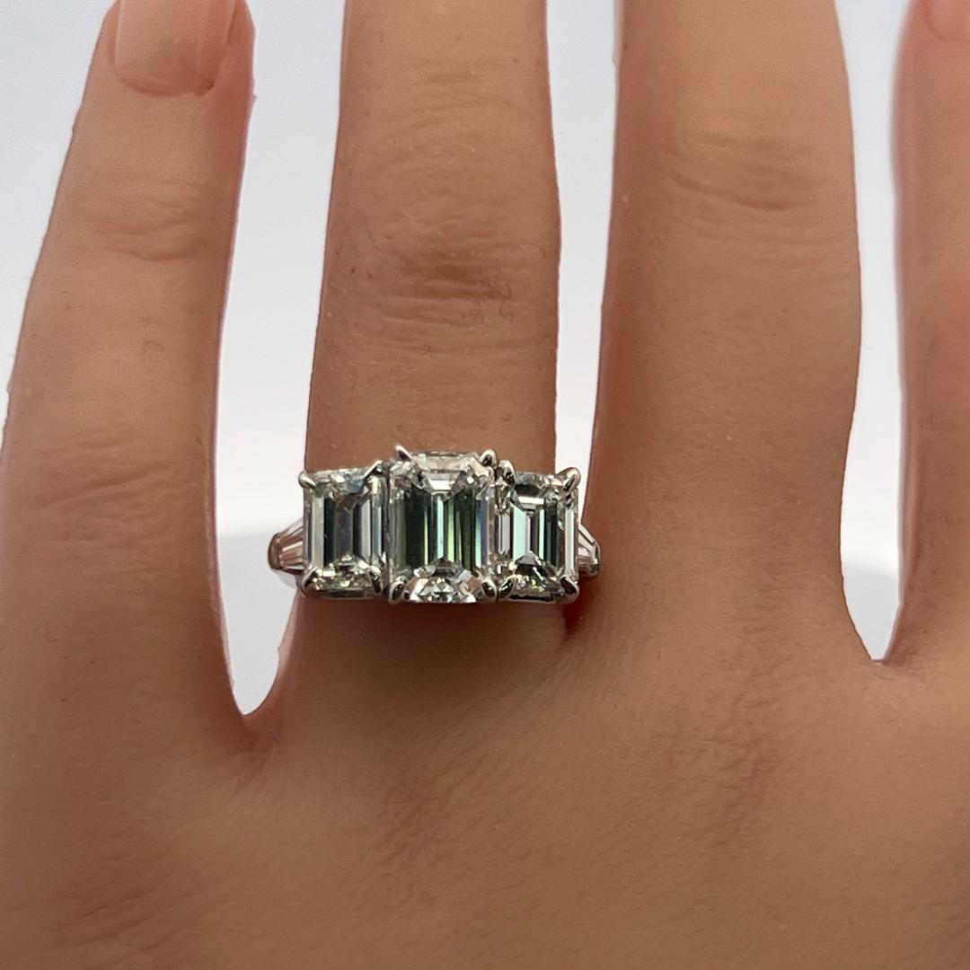 Platinum Three-Stone Ring with 5.6 Carat Emerald Cut H-SI1 GIA Diamonds Size 7