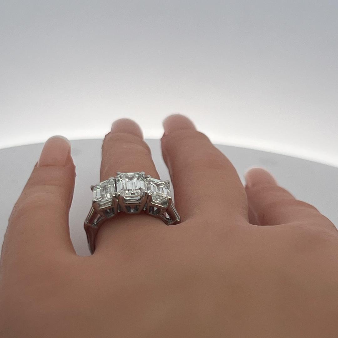 Platinum Three-Stone Ring with 5.6 Carat Emerald Cut H-SI1 GIA Diamonds Size 7