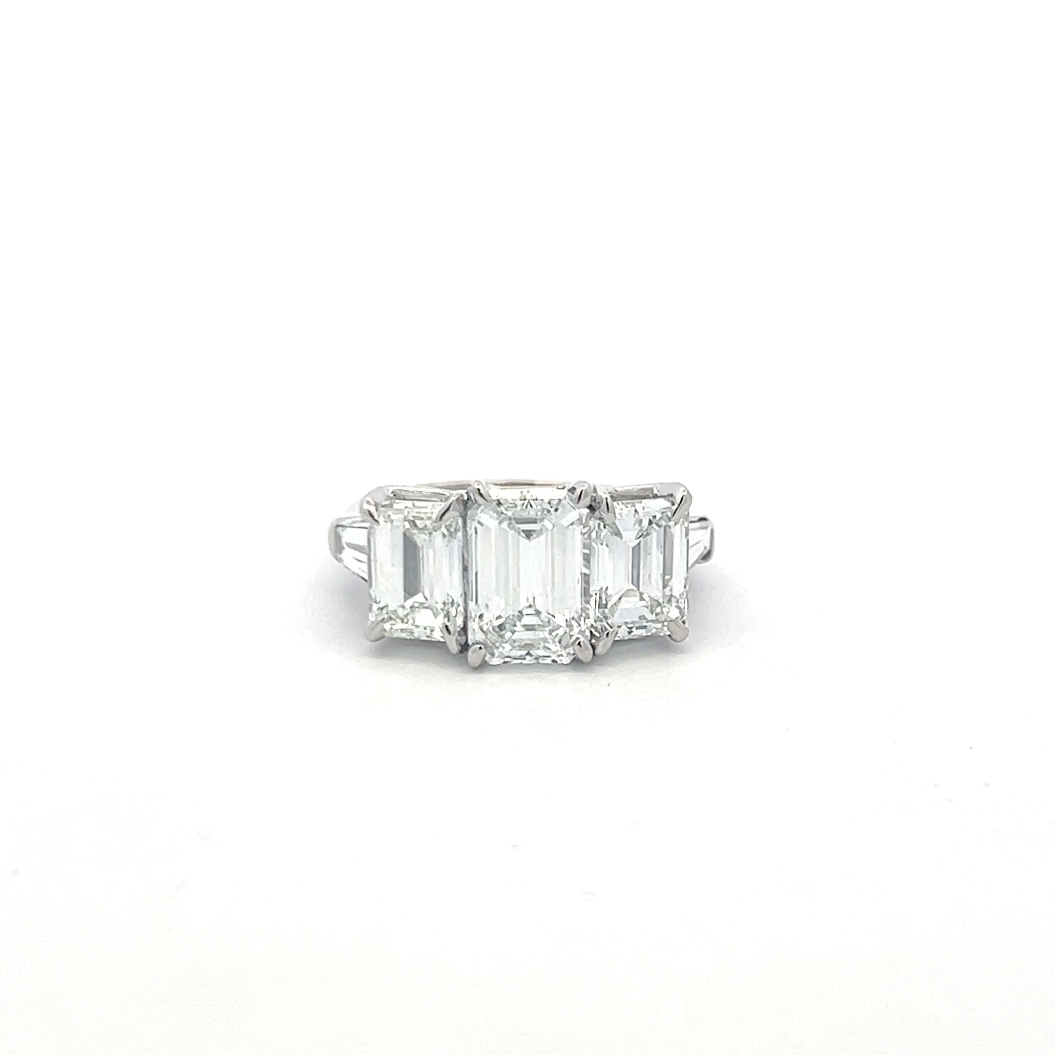 Platinum Three-Stone Ring with 5.6 Carat Emerald Cut H-SI1 GIA Diamonds Size 7