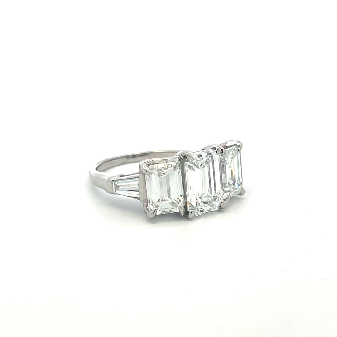Platinum Three-Stone Ring with 5.6 Carat Emerald Cut H-SI1 GIA Diamonds Size 7