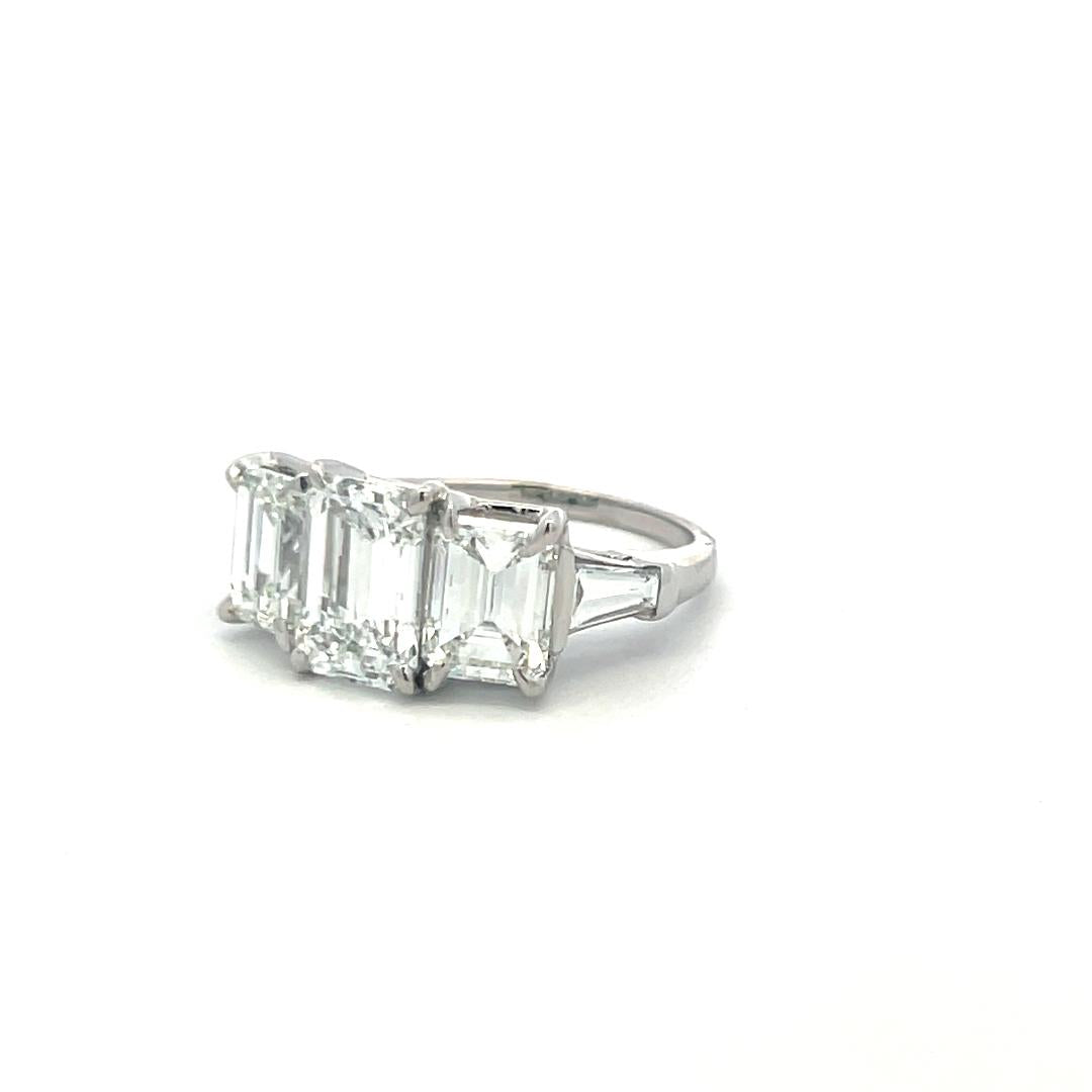 Platinum Three-Stone Ring with 5.6 Carat Emerald Cut H-SI1 GIA Diamonds Size 7