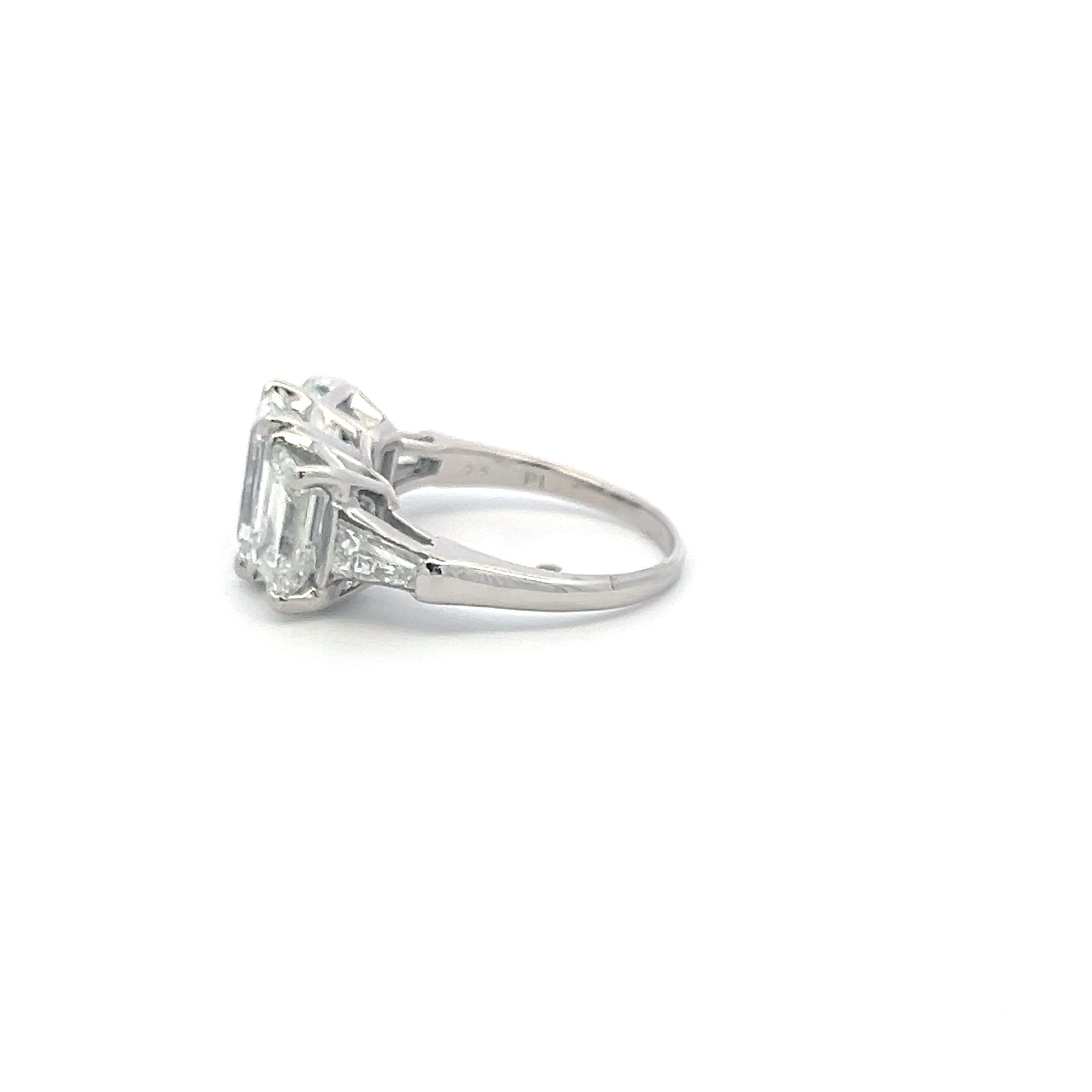 Platinum Three-Stone Ring with 5.6 Carat Emerald Cut H-SI1 GIA Diamonds Size 7