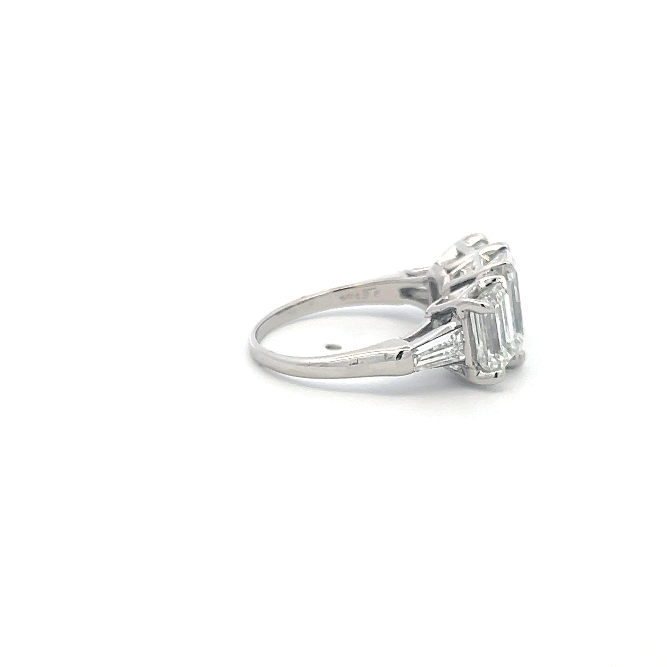 Platinum Three-Stone Ring with 5.6 Carat Emerald Cut H-SI1 GIA Diamonds Size 7