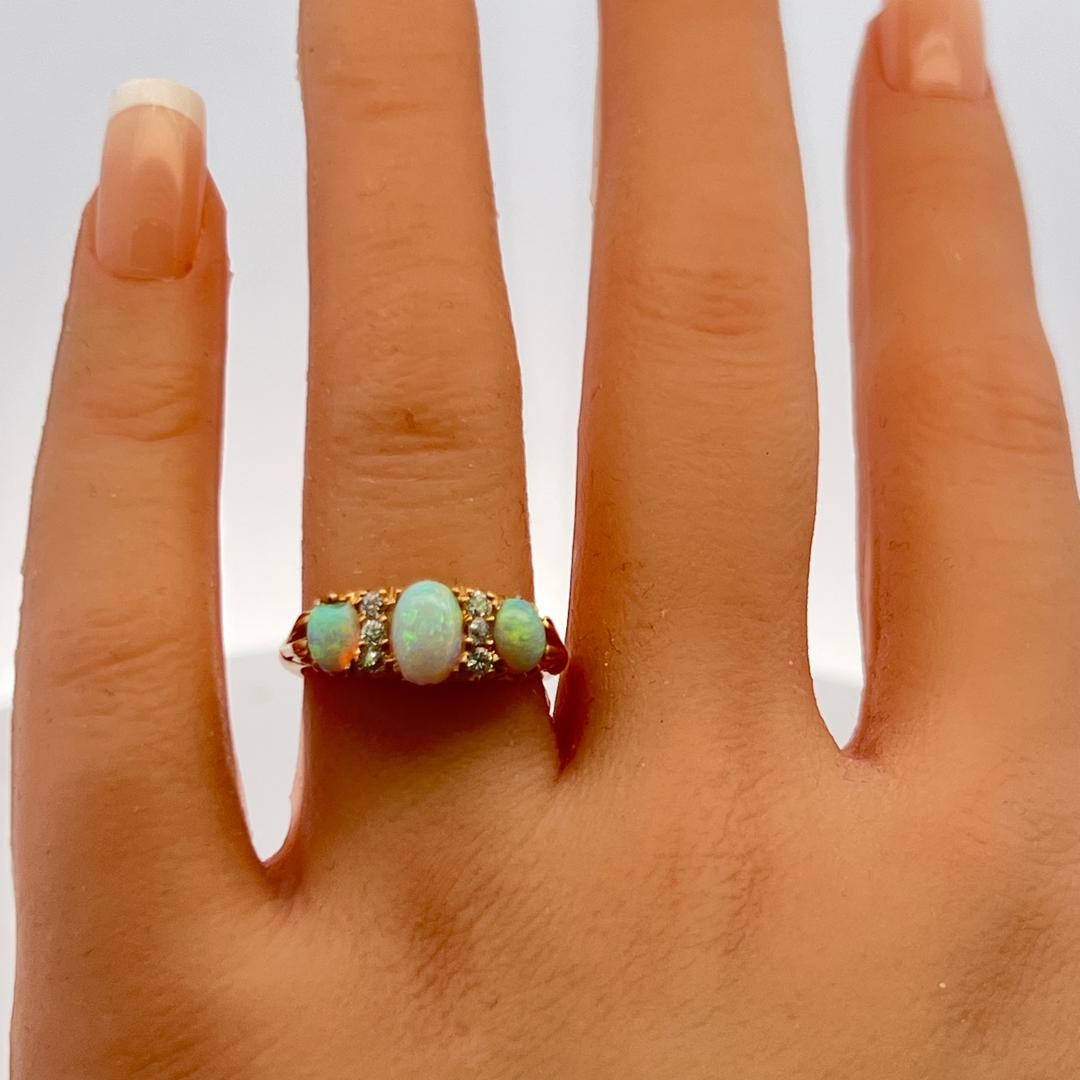 18K YG Three-Stone Ring with 0.12 Carat Diamonds & (4.9-7.5)x(3.9-4.3) MM Opal