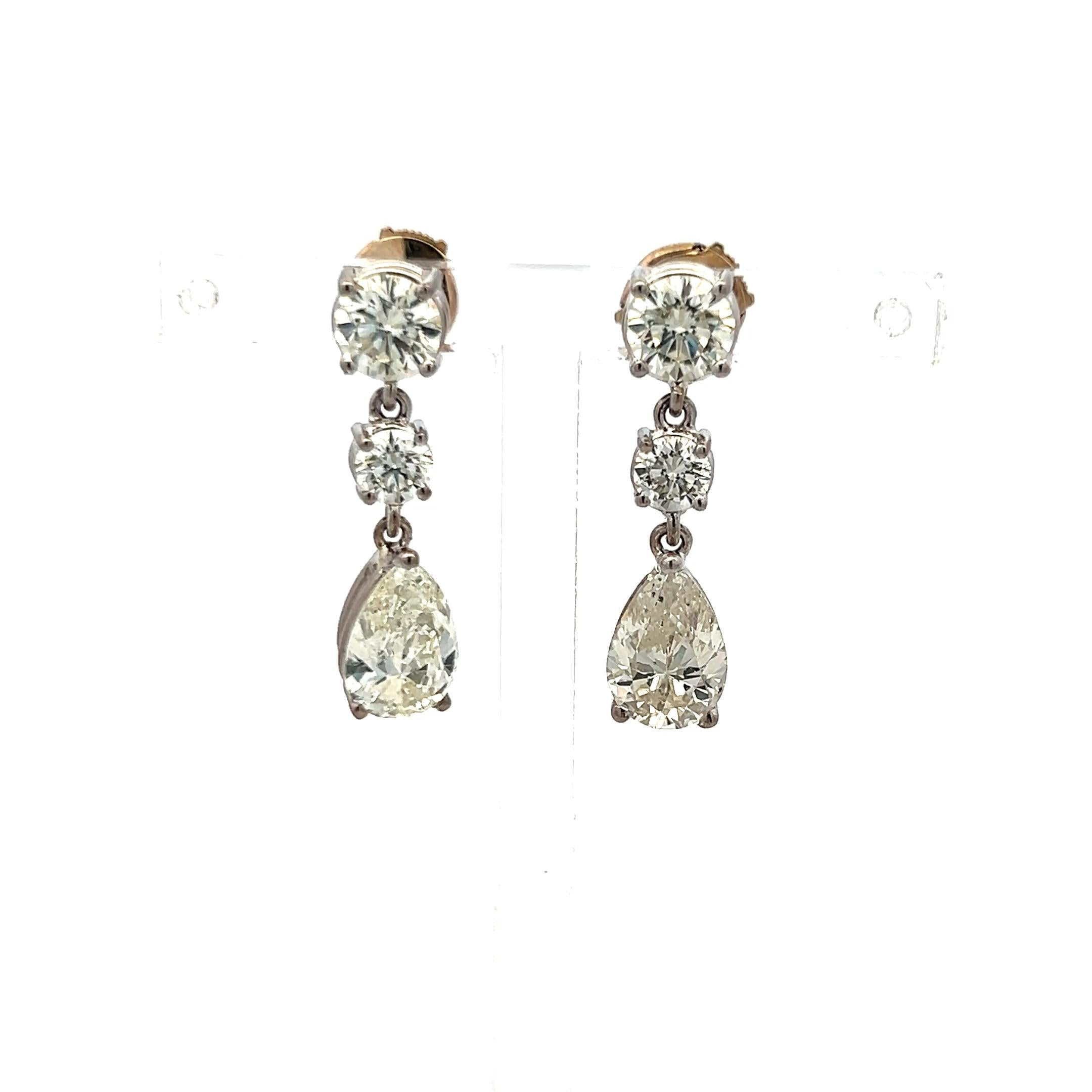 Vintage 5.62 Carat Pear And Round Diamonds 18 Karat White Gold Drop Earrings