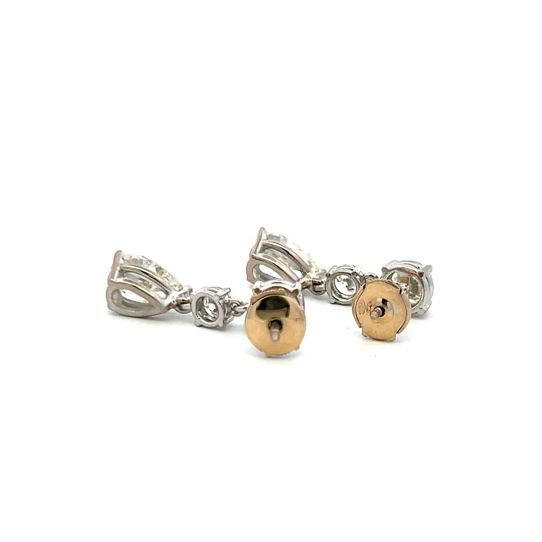 Vintage 5.62 Carat Pear And Round Diamonds 18 Karat White Gold Drop Earrings