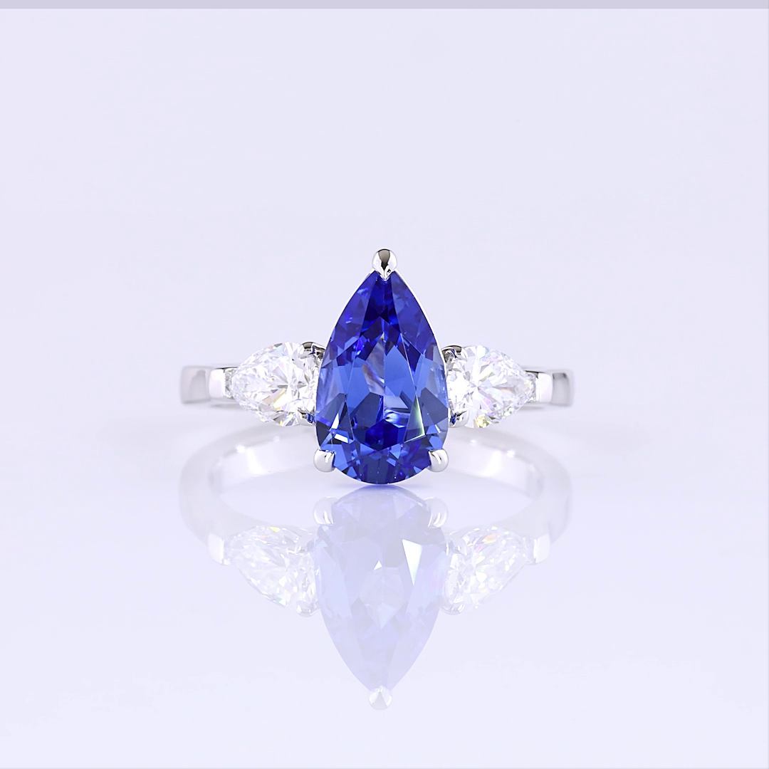 Lab-Grown 0.77 Carat Pear Blue-VS1 Diamond 14K White Gold Three Stones Ring