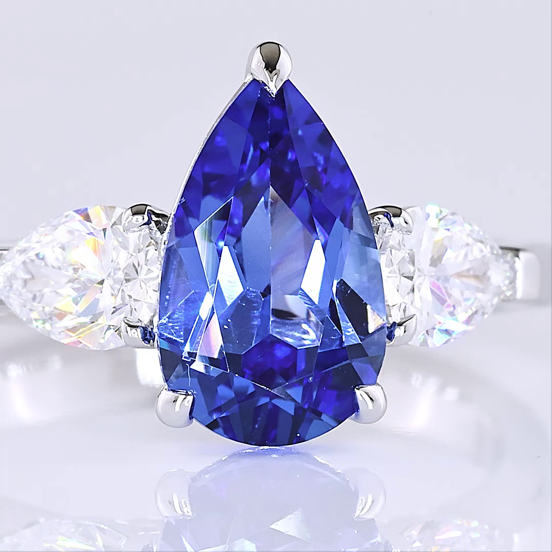 Lab-Grown 0.77 Carat Pear Blue-VS1 Diamond 14K White Gold Three Stones Ring